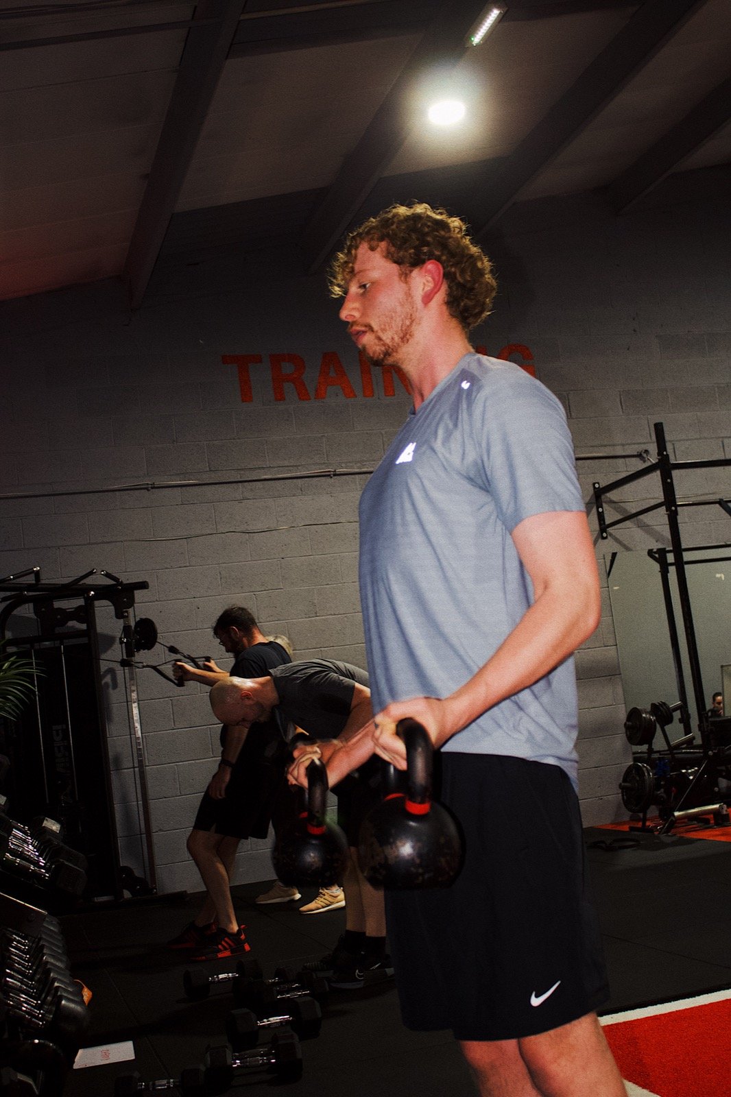 Member training with kettlebells during a Circuit class at GymSpace