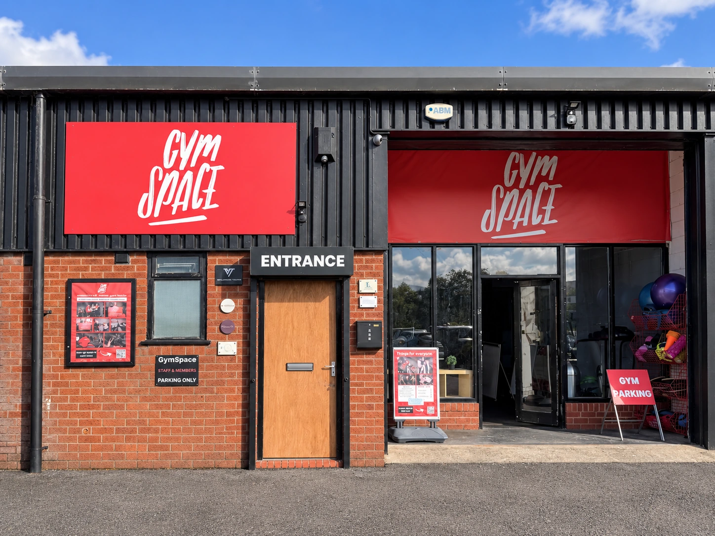GymSpace frontage with wooden entrance door beneath the ENTRANCE sign