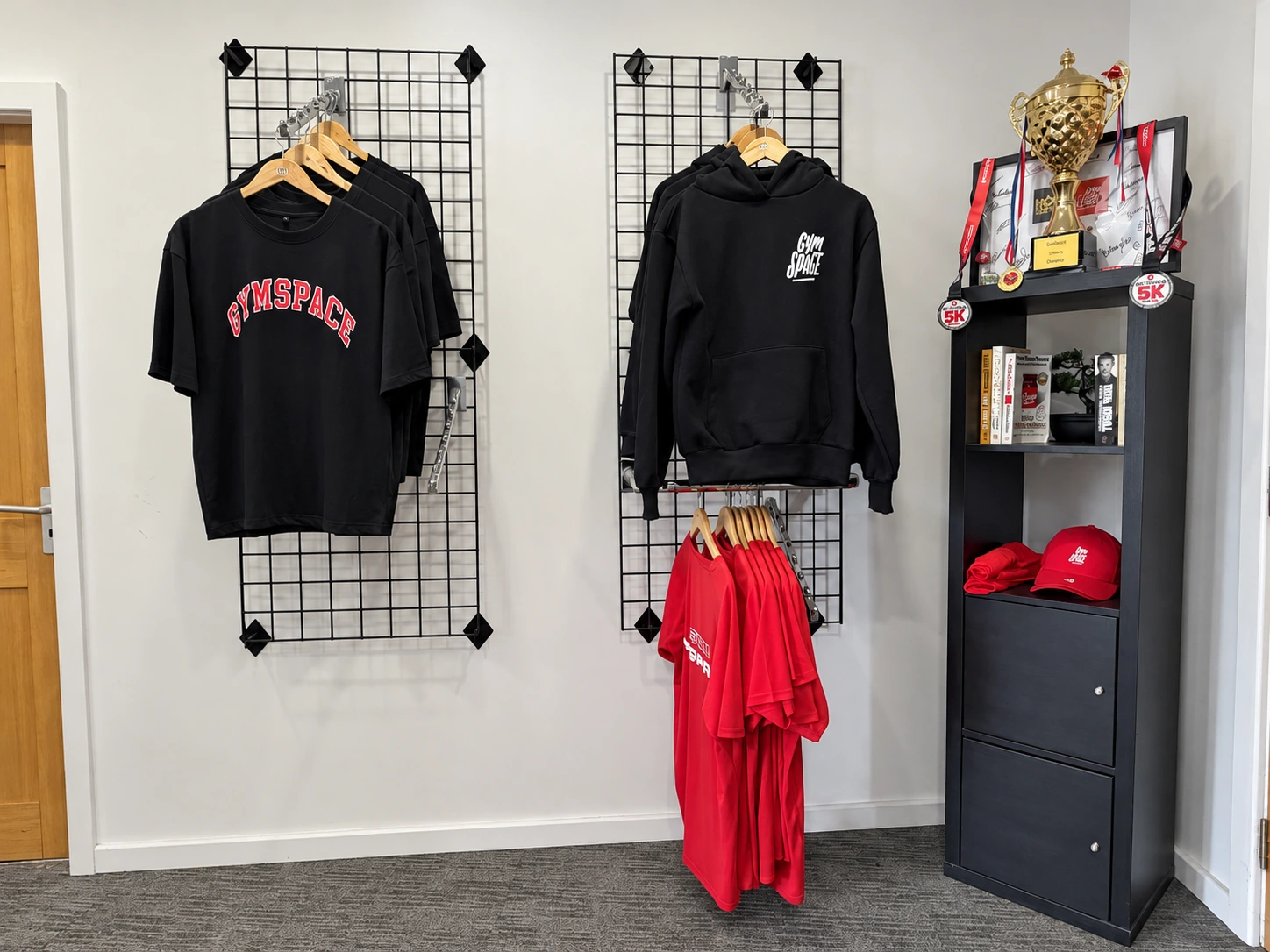 GymSpace hoodies, T-shirts and caps displayed at the studio