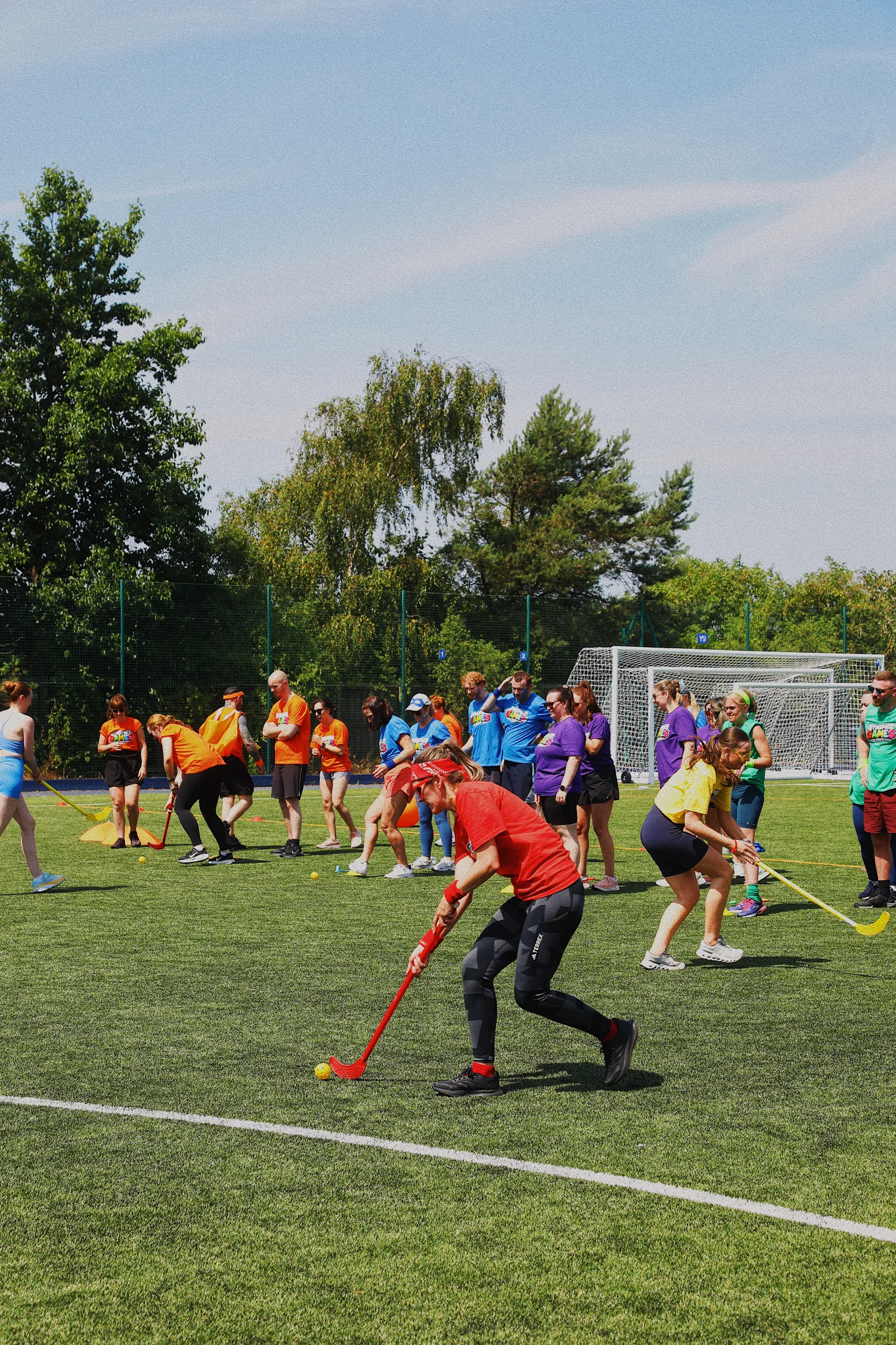 GymSpace Games participants taking part in a hockey challenge