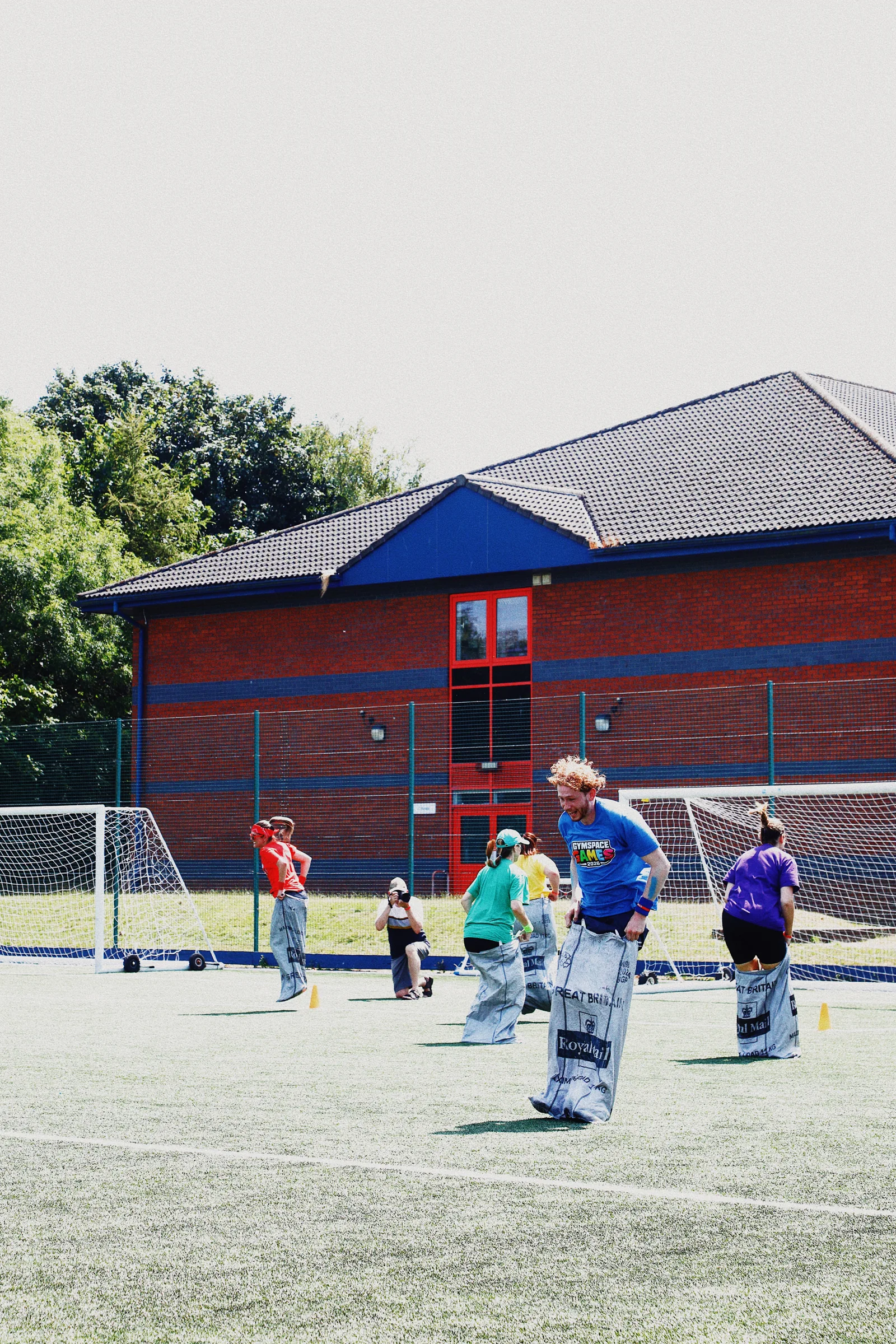 Participants competing in the GymSpace Games sack race