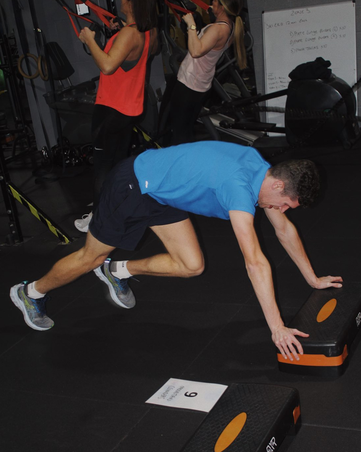 A man exercising at Gympace, sweating and motivated during a full-body circuit class. This image conveys the energy and effort involved in circuit training.